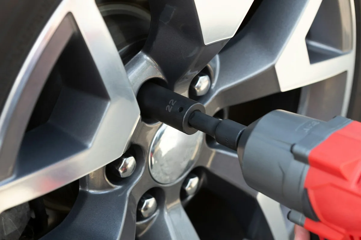 Close-up of a car wheel and brake area during a brake inspection